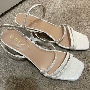 White strappy sandals with small heel